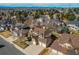 Aerial view of the neighborhood featuring tree-lined streets and mountain views in the distance at 17085 E Dorado Cir, Centennial, CO 80015