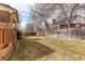 Spacious backyard featuring a well-maintained lawn and wooden fence, perfect for outdoor activities at 17085 E Dorado Cir, Centennial, CO 80015