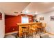 Basement bar with a wooden bar, bar stools, and a variety of liquor bottles on display at 17085 E Dorado Cir, Centennial, CO 80015