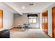 Finished basement with neutral carpet, electric piano, window, and closet at 17085 E Dorado Cir, Centennial, CO 80015