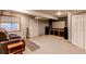 Finished basement featuring movie screen, projector, reclining seats, and wall-to-wall carpet at 17085 E Dorado Cir, Centennial, CO 80015