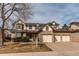 Inviting two-story home with a three car garage and landscaped front yard at 17085 E Dorado Cir, Centennial, CO 80015