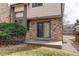 Charming home exterior with brick accents, sliding glass door and well-maintained landscaping at 17085 E Dorado Cir, Centennial, CO 80015
