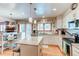 Spacious kitchen with granite countertops, breakfast bar, and stainless steel appliances at 17085 E Dorado Cir, Centennial, CO 80015