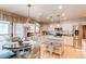 Updated kitchen with stainless steel appliances, granite counters, and breakfast nook at 17085 E Dorado Cir, Centennial, CO 80015