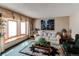 Cozy living room with a bay window and comfortable seating area at 17085 E Dorado Cir, Centennial, CO 80015