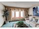 Bright living room with bay window, neutral colors, and comfortable furniture at 17085 E Dorado Cir, Centennial, CO 80015