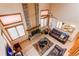 Elegant living room featuring a brick fireplace, high ceilings, and comfortable leather seating at 17085 E Dorado Cir, Centennial, CO 80015