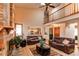 Spacious living room with fireplace and open floor plan to kitchen at 17085 E Dorado Cir, Centennial, CO 80015