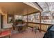 Inviting covered patio featuring wicker furniture and outdoor seating, creating a comfortable space to relax at 17085 E Dorado Cir, Centennial, CO 80015