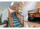 Curved staircase with wooden railings leading to the second floor at 17085 E Dorado Cir, Centennial, CO 80015