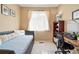 Bedroom with a daybed, desk and a window with natural light at 11230 Osage Cir # B, Northglenn, CO 80234