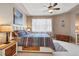 Comfortable bedroom with a queen-sized bed, wooden accents, and a bright window at 11230 Osage Cir # B, Northglenn, CO 80234