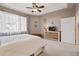 Spacious bedroom with a ceiling fan, carpet, natural light and a door to exit at 11230 Osage Cir # B, Northglenn, CO 80234