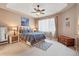 Relaxing bedroom with a ceiling fan, carpet, and natural light at 11230 Osage Cir # B, Northglenn, CO 80234