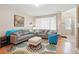 Comfortable living area with hardwood floors, stylish furniture, and bright natural light at 11230 Osage Cir # B, Northglenn, CO 80234