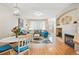 Bright and airy living space featuring a fireplace, hardwood floors, and cozy seating area at 11230 Osage Cir # B, Northglenn, CO 80234
