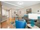 Open concept living area features hardwood flooring, modern furnishings, and dining space at 11230 Osage Cir # B, Northglenn, CO 80234