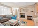 Inviting living room features a fireplace, modern decor, and hardwood flooring at 11230 Osage Cir # B, Northglenn, CO 80234