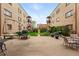 Beautiful courtyard area featuring patio seating, barbecue grills, and lush landscaping at 1175 N Emerson St # 103, Denver, CO 80218