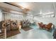Spacious laundry room with multiple washers, dryers, and a convenient folding area at 1175 N Emerson St # 103, Denver, CO 80218