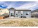 Back exterior featuring a patio and a fenced yard at 6495 S Harvest St, Aurora, CO 80016