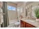 Well-maintained bathroom featuring a shower/tub combination and granite vanity at 6495 S Harvest St, Aurora, CO 80016
