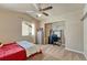 A room that provides carpet, natural light, a desk area, a closet and a ceiling fan at 6495 S Harvest St, Aurora, CO 80016