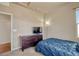 Comfortable bedroom with plush carpet, dresser, and a cozy atmosphere at 6495 S Harvest St, Aurora, CO 80016