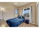 Cozy bedroom featuring neutral carpet, two bright windows and a comfortable bed at 6495 S Harvest St, Aurora, CO 80016