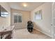 Inviting bedroom with plush carpet, natural light, desk and comfortable chair at 6495 S Harvest St, Aurora, CO 80016