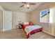A bedroom that provides carpet, natural light, a closet and a ceiling fan at 6495 S Harvest St, Aurora, CO 80016