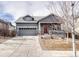 Charming single-Gathering home with a well-manicured front yard and attached two-car garage at 6495 S Harvest St, Aurora, CO 80016