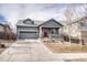 Charming single-Gathering home with a well-manicured front yard and attached two-car garage at 6495 S Harvest St, Aurora, CO 80016