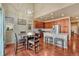 Bright kitchen features granite countertops and stainless-steel appliances, seamlessly connected to a dining area at 6495 S Harvest St, Aurora, CO 80016