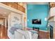 Spacious living room featuring a vaulted ceiling and an eye-catching accent wall at 6495 S Harvest St, Aurora, CO 80016
