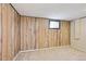 Basement featuring paneled walls, carpeting, and a window at 8250 Chase Way, Arvada, CO 80003
