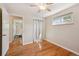Bedroom with hardwood floors, a window, and a closet at 8250 Chase Way, Arvada, CO 80003