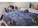 Bedroom featuring a patterned bedspread and workspace at 8250 Chase Way, Arvada, CO 80003