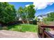 Beautiful backyard with a well-maintained lawn, wooden deck, and mature landscaping at 5193 E 119Th Way, Thornton, CO 80233