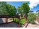 Private backyard with wooden deck, green lawn, and fenced perimeter at 5193 E 119Th Way, Thornton, CO 80233