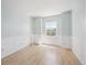 Light-filled bedroom with wainscoting, and a window with neighborhood views at 5193 E 119Th Way, Thornton, CO 80233