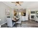 Charming dining area with a view into the kitchen, creating a connected and inviting space at 5193 E 119Th Way, Thornton, CO 80233