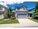 Charming two-story home with a well-manicured lawn and gray two-car garage at 5193 E 119Th Way, Thornton, CO 80233