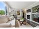 Open concept living space with fireplace, hardwood floors, and seamless access to dining area and kitchen at 5193 E 119Th Way, Thornton, CO 80233