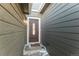 House's front entrance with brown door and sidelights at 7980 Larkspur Cir # 225, Frederick, CO 80530