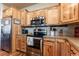 Kitchen with stainless steel appliances and wood cabinets at 7980 Larkspur Cir # 225, Frederick, CO 80530