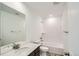 Well-lit bathroom featuring a tub, tiled shower, modern vanity, and updated fixtures at 4592 Windmill Dr, Brighton, CO 80601