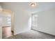 Cozy bedroom with neutral carpet and a view to the adjacent room at 4592 Windmill Dr, Brighton, CO 80601
