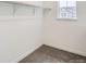 Walk-in closet with carpet, white walls, wire shelving, and a window for natural light at 4592 Windmill Dr, Brighton, CO 80601